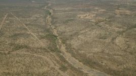HD stock footage aerial video of orbiting a dry riverbed in the savanna, Zimbabwe Aerial Stock Footage | CAP_026_024