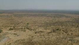 HD stock footage aerial video of panning across open savanna, Zimbabwe Aerial Stock Footage | CAP_026_028