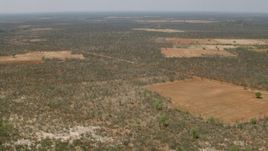 HD stock footage aerial video of panning across the savanna to reveal fields, Zimbabwe Aerial Stock Footage | CAP_026_064
