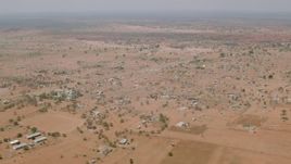 HD stock footage aerial video of flying by an African village in Zimbabwe Aerial Stock Footage | CAP_026_109