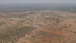 HD stock footage aerial video of approaching an African village in Zimbabwe Aerial Stock Footage | CAP_026_113
