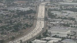 HD aerial stock footage of flying by traffic on Highway 91, hazy day, Corona, California  Aerial Stock Footage | CBAX01_032