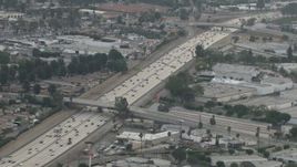 HD aerial stock footage of following light traffic on Highway 91, hazy day, Corona, California  Aerial Stock Footage | CBAX01_033