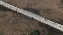 HD aerial stock footage of tracking light traffic on Highway 71 through hills, Chino Hills, California Aerial Stock Footage | CBAX01_046