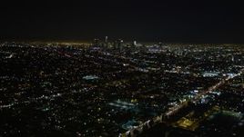 5K aerial stock footage tilt up revealing downtown Los Angeles skyline at night, California Aerial Stock Footage | DCA01_007