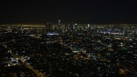 5K aerial stock footage flying by downtown Los Angeles skyline at night, California Aerial Stock Footage | DCA01_010