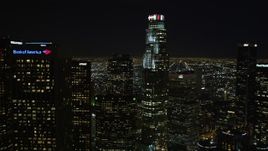 5K aerial stock footage tilt from freeway to reveal Downtown Los Angeles skyscrapers and city lights, California Aerial Stock Footage | DCA01_013E