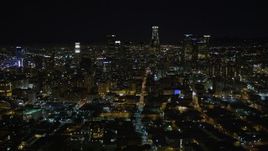 5K aerial stock footage flying away from Downtown Los Angeles skyline at night, California Aerial Stock Footage | DCA01_015