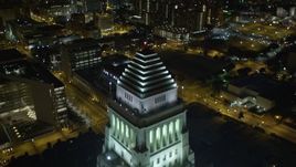 5K aerial stock footage flying over Highway 110 and Los Angeles City Hall, revealing skyscrapers at night, California Aerial Stock Footage | DCA01_030