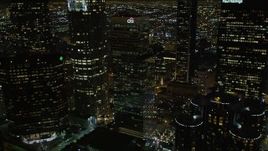 5K aerial stock footage flying by skyscrapers and public library in downtown Los Angeles at night, California Aerial Stock Footage | DCA01_055