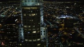 5K aerial stock footage flying by skyscrapers and buildings in Downtown Los Angeles at night, California Aerial Stock Footage | DCA01_056