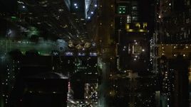 5K aerial stock footage bird's eye view of West 5th Avenue, tilt up to skyscrapers in Downtown Los Angeles at night, California Aerial Stock Footage | DCA01_057