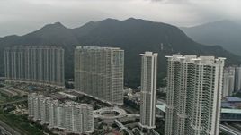 4K aerial stock footage flyby apartment complexes in Tung Chung, Lantau Island, Hong Kong, China Aerial Stock Footage | DCA02_003