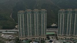 4K aerial stock footage flyby Caribbean Coast apartment complex in Tung Chung, Lantau Island, Hong Kong, China Aerial Stock Footage | DCA02_004