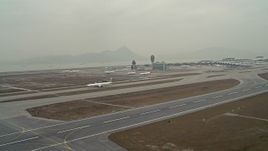 4K aerial stock footage of passing commercial jets at Hong Kong International Airport, China Aerial Stock Footage | DCA02_035