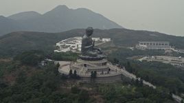 4K aerial stock footage of an orbit around the Tian Tan Buddha statue on Lantau Island, Hong Kong, China Aerial Stock Footage | DCA02_042