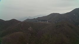 4K aerial stock footage flyby Ngong Ping Cable Car on Lantau Island, Hong Kong, China Aerial Stock Footage | DCA02_044