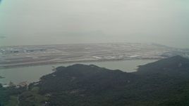 4K aerial stock footage approach Hong Kong International Airport from  Lantau Island, Hong Kong, China Aerial Stock Footage | DCA02_045E