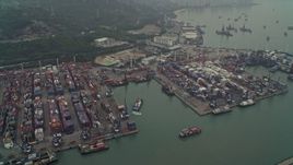 4K aerial stock footage of barges and cargo containers at Pillar Point port, New Territories, Hong Kong, China Aerial Stock Footage | DCA02_056