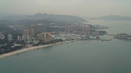 4K aerial stock footage of Hong Kong Gold Coast Hotel, marina, and waterfront apartment high-rises in New Territories, Hong Kong, China Aerial Stock Footage | DCA02_060