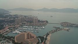 4K aerial stock footage flyby Hong Kong Gold Coast Hotel, marina, and waterfront apartment high-rises in New Territories, Hong Kong, China Aerial Stock Footage | DCA02_061
