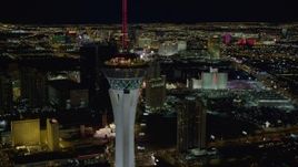 4K aerial stock footage of orbiting top of Stratosphere, revealing hotels along the strip, Las Vegas, Nevada Night Aerial Stock Footage | DCA03_010