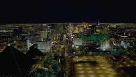 4K aerial stock footage of Las Vegas Boulevard, past Mandalay Bay, Excalibur, Luxor, Las Vegas, Nevada Night Aerial Stock Footage | DCA03_014