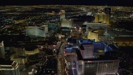 4K aerial stock footage of Las Vegas Boulevard between Caesar's Palace and Flamingo, toward The Mirage and Treasure Island, Las Vegas, Nevada Night Aerial Stock Footage | DCA03_019