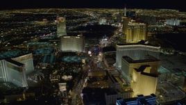 4K aerial stock footage of Las Vegas Boulevard between The Mirage and The Venetian, toward Treasure Island, Las Vegas, Nevada Night Aerial Stock Footage | DCA03_020