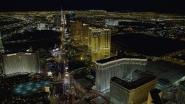 4K aerial stock footage of panning across Las Vegas Boulevard, from Treasure Island to the Venetian, Las Vegas, Nevada, Night Aerial Stock Footage | DCA03_021