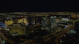 4K aerial stock footage of the back of The Bellagio, Aria Resort, Paris, Planet Hollywood, Las Vegas, Nevada Night Aerial Stock Footage | DCA03_022