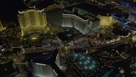 4K aerial stock footage of flying by Palazzo, Venetian, Harrah's, Imperial Palace, Las Vegas, Nevada Night Aerial Stock Footage | DCA03_068