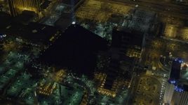4K aerial stock footage of flying by Luxor Hotel and Casino, Las Vegas, Nevada Night Aerial Stock Footage | DCA03_073