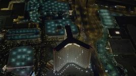 4K aerial stock footage of flying by The Mirage, revealing Treasure Island, Las Vegas, Nevada Night Aerial Stock Footage | DCA03_079
