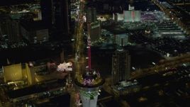4K aerial stock footage of orbiting Stratosphere, revealing Las Vegas Boulevard, hotels on Strip, Las Vegas, Nevada Night Aerial Stock Footage | DCA03_084