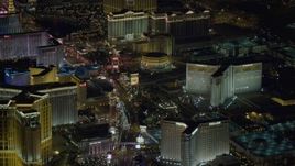 4K aerial stock footage tilt to reveal hotels along Las Vegas Strip, Nevada Night Aerial Stock Footage | DCA03_122
