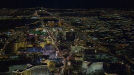 4K aerial stock footage of hotels on Las Vegas Strip, descending toward Las Vegas Boulevard, Nevada Night Aerial Stock Footage | DCA03_124