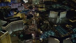 4K aerial stock footage tilt to reveal hotels along the Las Vegas Strip, Nevada Night Aerial Stock Footage | DCA03_128