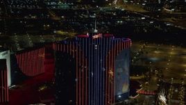 4K aerial stock footage of approaching top of Rio Hotel and Casino, Las Vegas, Nevada Night Aerial Stock Footage | DCA03_149