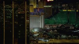 4K aerial stock footage of flying by Mandalay Bay, revealing hotels on Las Vegas Boulevard, Nevada Night Aerial Stock Footage | DCA03_163