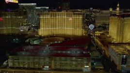 4K aerial stock footage of flying behind Planet Hollywood, Paris and Bally's, Las Vegas, Nevada Night Aerial Stock Footage | DCA03_168