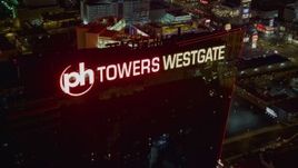 4K aerial stock footage approach and orbit Planet Hollywood Towers Westgate, Las Vegas, Nevada Night Aerial Stock Footage | DCA03_204
