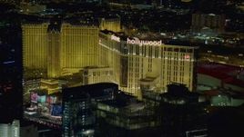 4K aerial stock footage of zooming in on Planet Hollywood Resort and Casino, Las Vegas, Nevada Night Aerial Stock Footage | DCA03_214