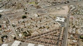 4K aerial stock footage flying over suburbs and warehouses in East Las Vegas, Nevada Aerial Stock Footage | DCA04_003