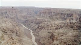 4K aerial stock footage of a helicopter flying over the Colorado River in Grand Canyon, Arizona Aerial Stock Footage | DCA04_026