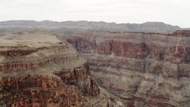 4K aerial stock footage of flying by jagged cliffs in Grand Canyon, Arizona Aerial Stock Footage | DCA04_030