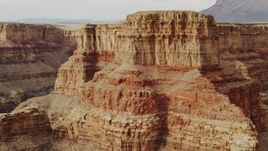 4K aerial stock footage of flying by a rock formation in Grand Canyon, Arizona Aerial Stock Footage | DCA04_037