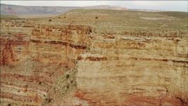 4K aerial stock footage of flying by a cliff face in Grand Canyon, Arizona Aerial Stock Footage | DCA04_046