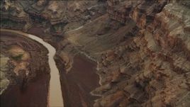 4K aerial stock footage of panning across the Colorado River, and tilt to rock formations in Grand Canyon, Arizona Aerial Stock Footage | DCA04_052