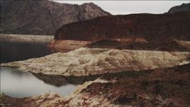 4K aerial stock footage of flying by foothills and over shore of Lake Mead, Nevada Aerial Stock Footage | DCA04_065